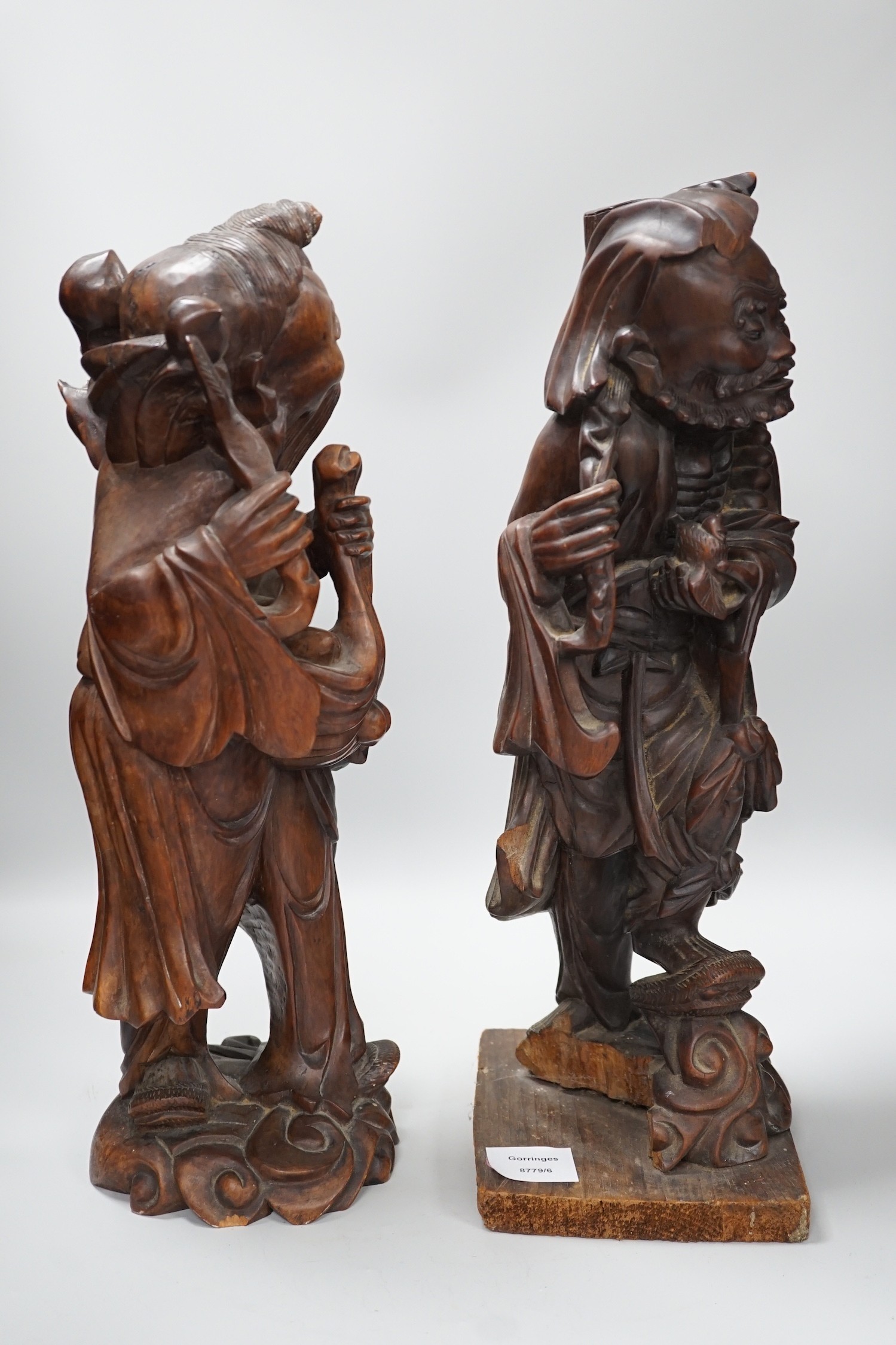 Two Chinese hardwood figures of luohans, early 20th century Tallest 48cm
